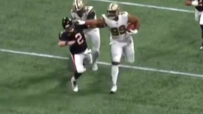 Saints DT Shy Tuttle stiff-arms Falcons QB Matt Ryan after an interception during a 2019 game. Credit: BarDown.com